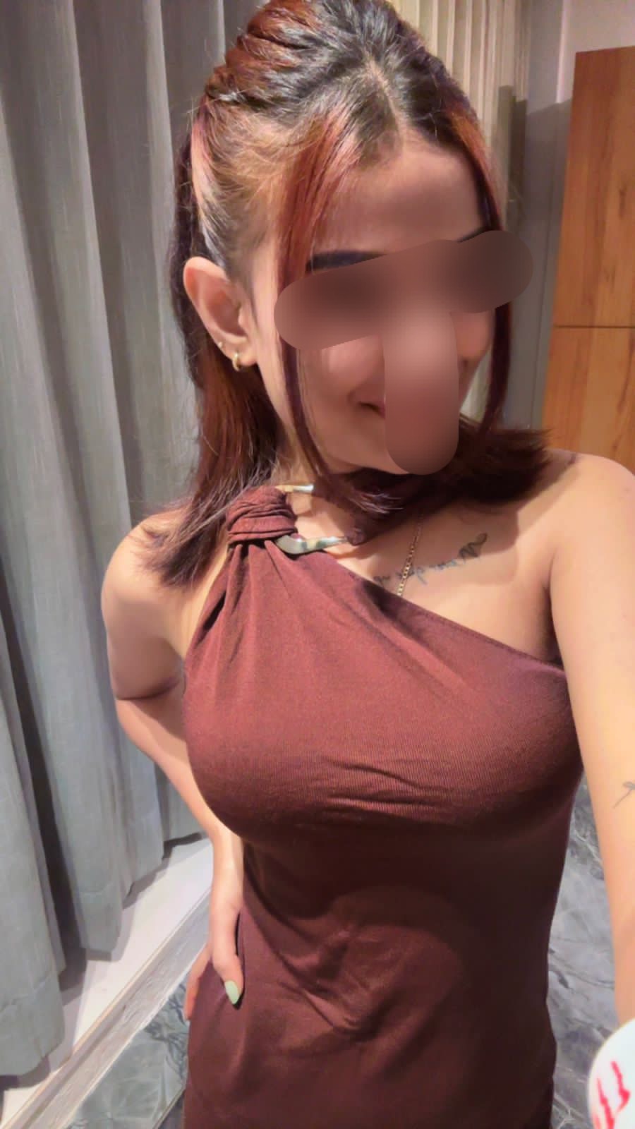 Blurred therapist portrait with a soft neutral styling.